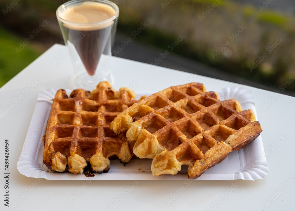 Belgian sugar waffles with black coffee served outdoor Belgian sugar waffles with black coffee served outdoor