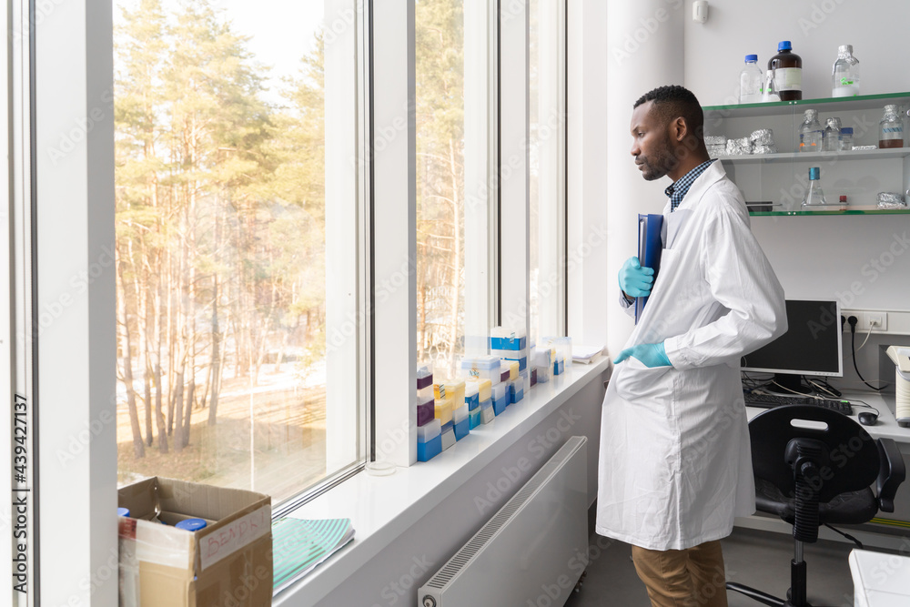 Pensive Scientist Looking Through The Window