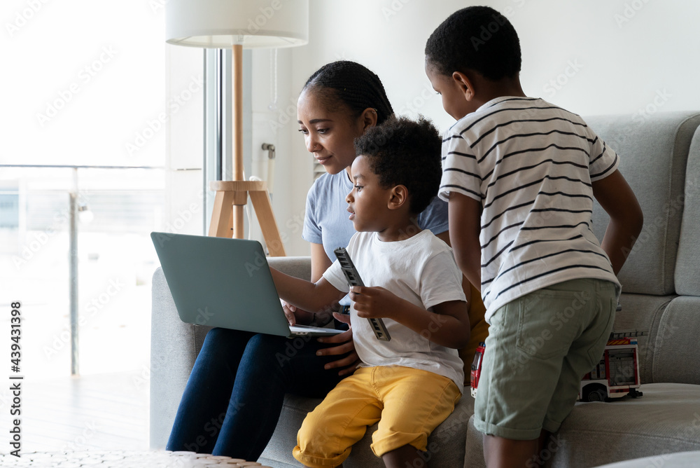 Mother working from home with her children. Mother working from home with her children.