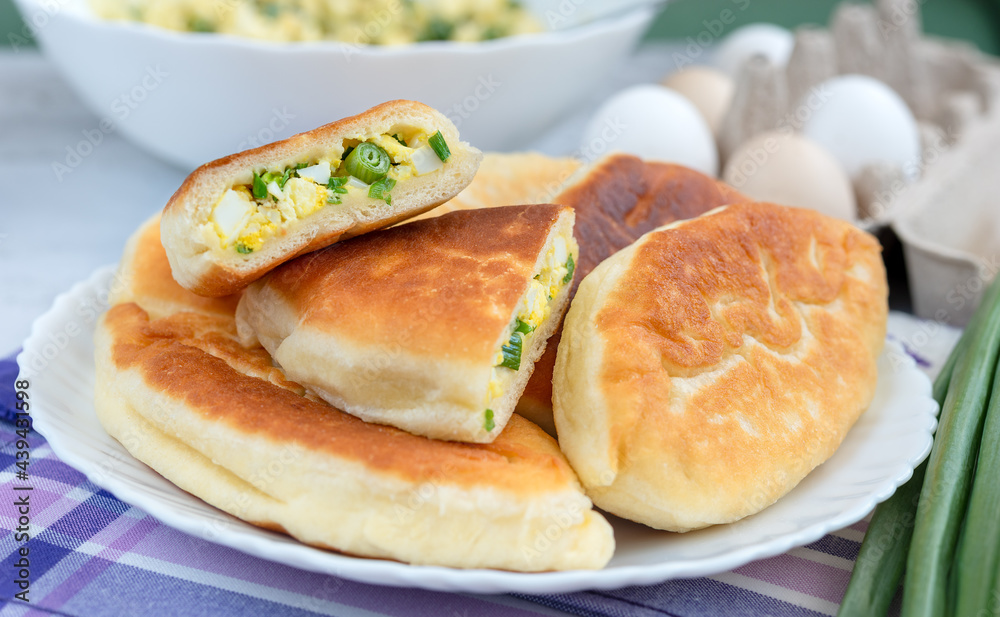 Fried yeast pies stuffed with green onions and eggs