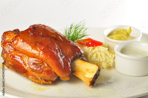 Canvas Print Roasted pork knuckle with fresh cabbage salad, selective focus