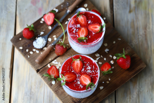 Chia yogurt in cups with strawberries and seeds. Healthly food. Keto breakfast or snack.