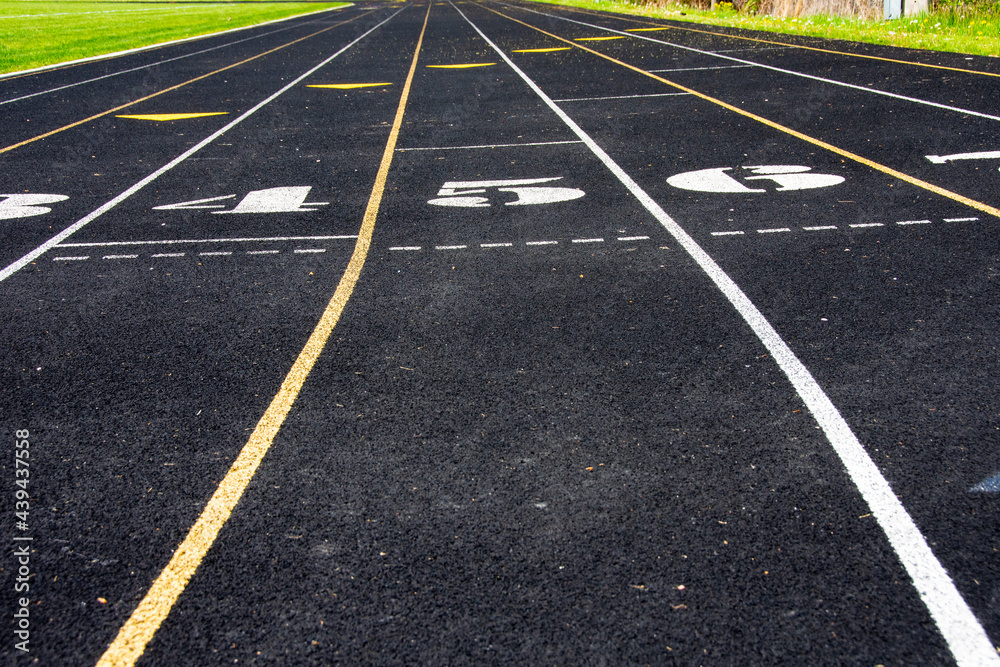 Athletic or running track with striped for lanes.