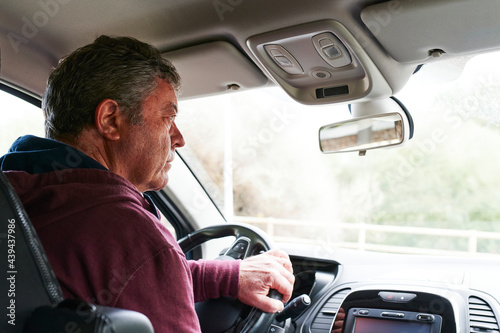 Man turning right while driving photo