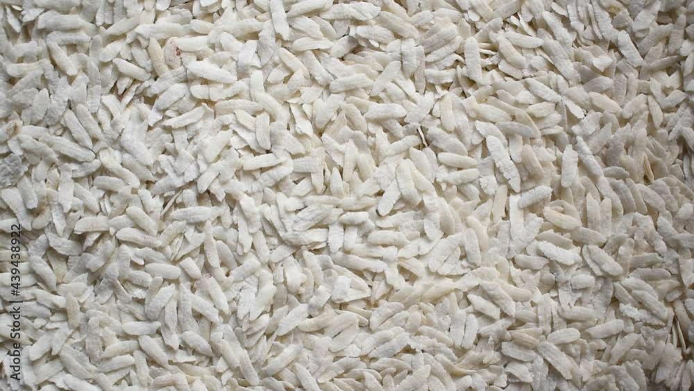 Raw whole dried flattened rice flakes Raw whole dried flattened rice flakes