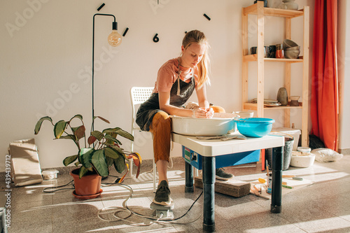 Woman working in her cermaic studio photo