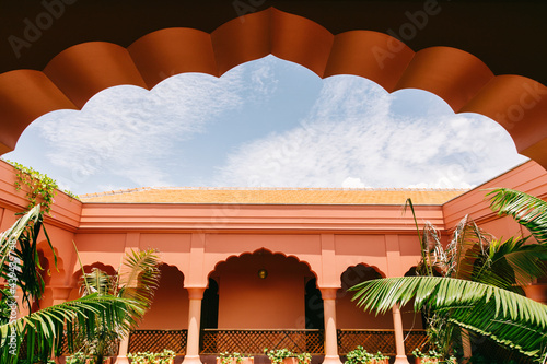 Red Oriental Architecture Detail With Pillars And Arches And Sky photo