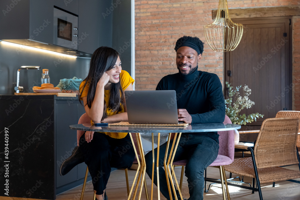 Diverse freelancers working in kitchen Diverse freelancers working in kitchen