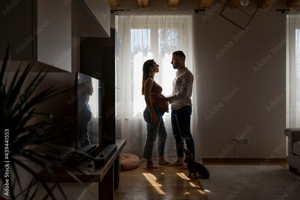 Pregnant woman with her boyfriend and dog Pregnant woman with her boyfriend and dog