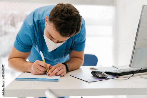 Veterinarian filling in the data of a blood sample