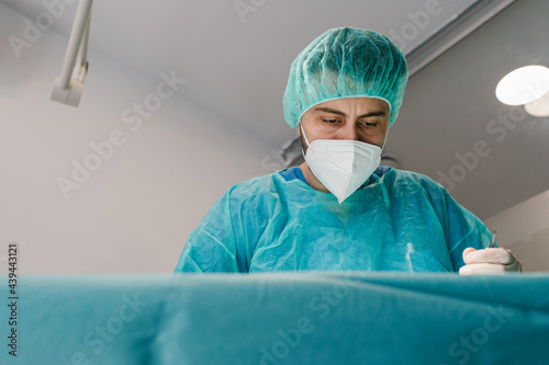 Portrait of a vet surgeon while operating photo