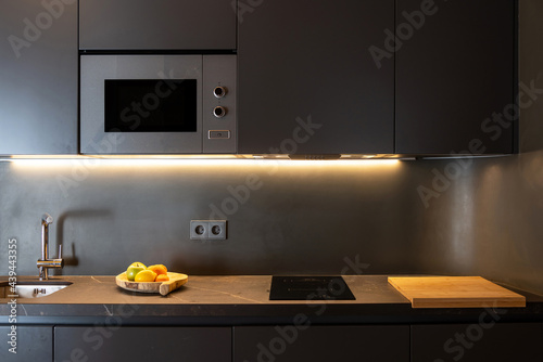 Illuminated furniture in contemporary kitchen photo