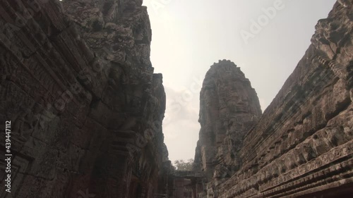 Outside gallery depicting the richely decorated walls and towers of the temples of Angkor Wat, Cambodia photo