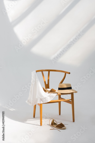 Clothing complements on modern chair  photo