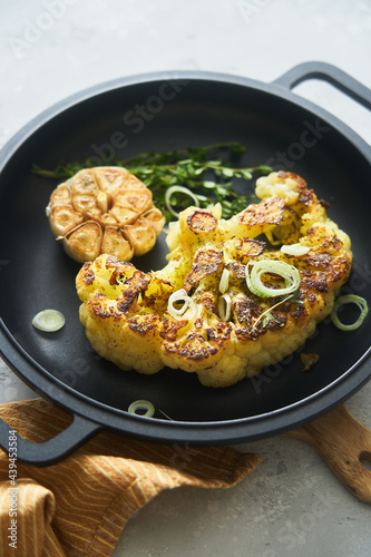 Seared vegetables on frying pan photo