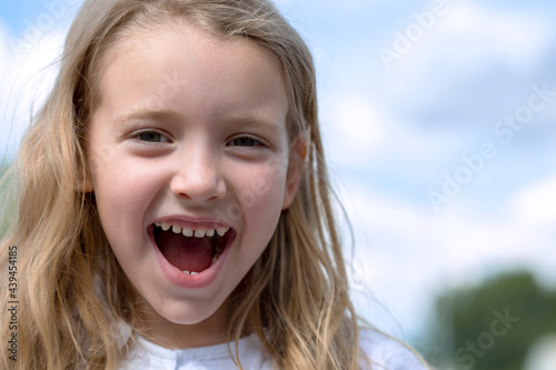 Portrait of a beautiful, happy school girl  