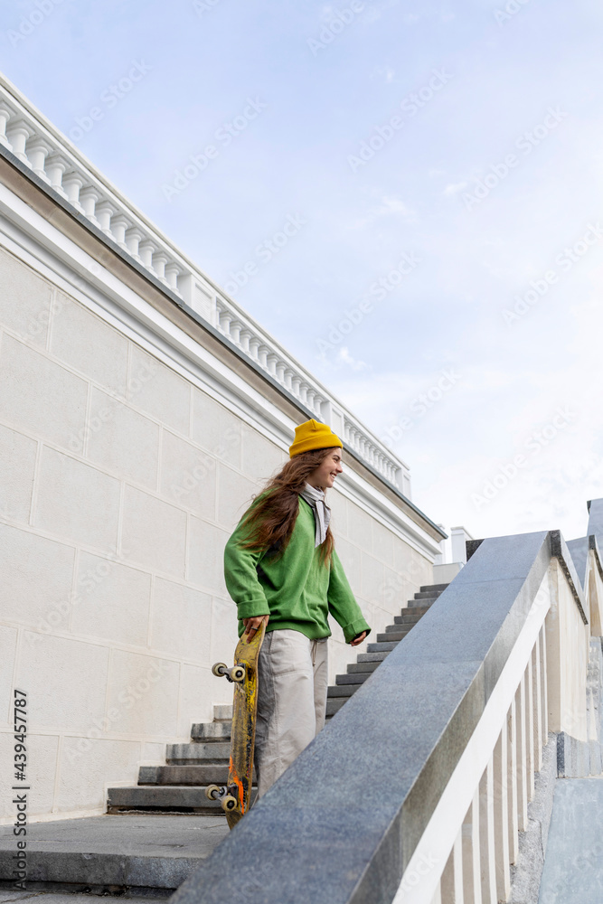 Pretty girl skateboarder outdoors Pretty girl skateboarder outdoors