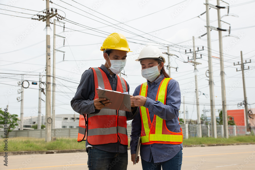 Teamwork Engineer working outdoor onsite service, electrical engineer team Teamwork Engineer working outdoor onsite service, electrical engineer team