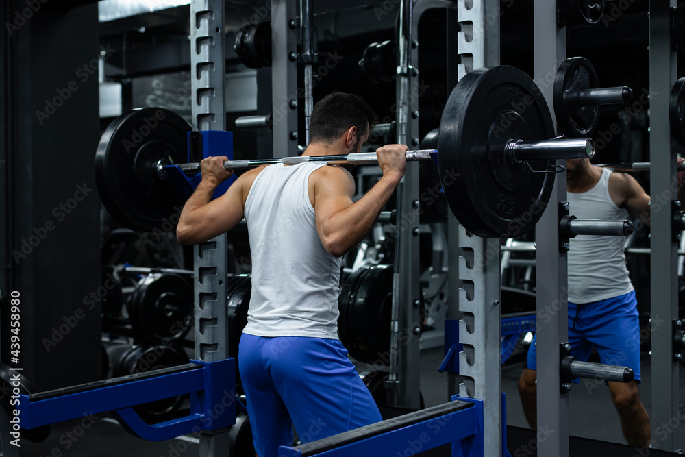 Man Lifts Weights In A Gym Man Lifts Weights In A Gym