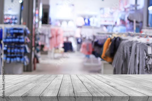 Wooden desk on bokeh blur abstract interior background