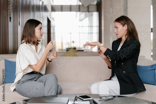Deaf businesswomen having nonverbal conversation