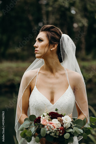 Gorgeous Bride Holding Bouquet photo