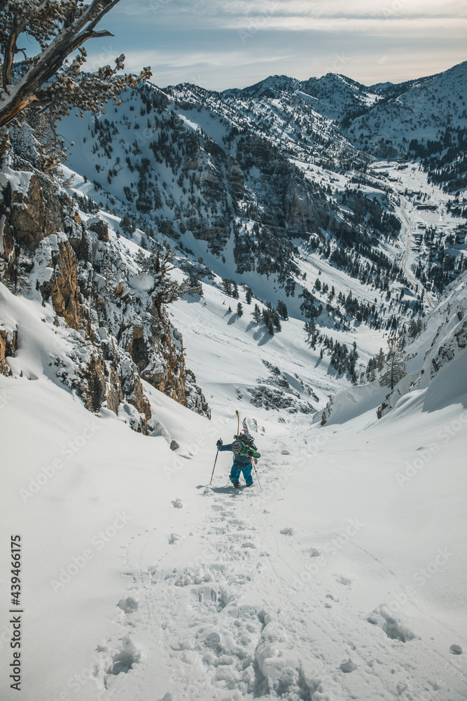 skitourer hiking in couloir skitourer hiking in couloir