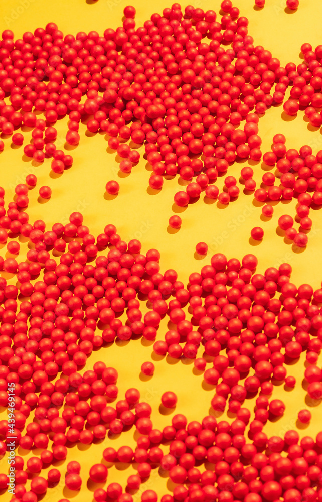 Bunch Of Red Round Shapes-Balls On Yellow Background. Bunch Of Red Round Shapes-Balls On Yellow Background.