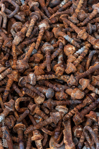 Background texture of large rusty bolts stacked