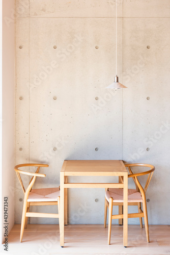 Wooden table with chairs and lamp in coffee shop photo