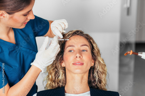 A Woman on a Cosmetic Treatment  photo