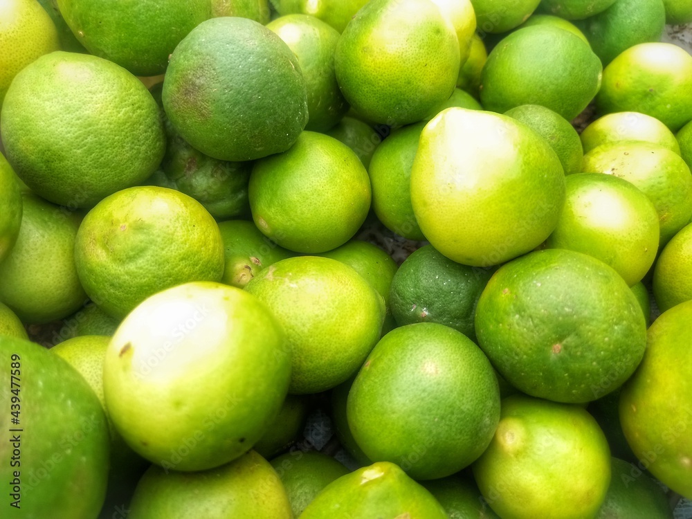 pile of limes in one of the sellers in the traditional market pile of limes in one of the sellers in the traditional market