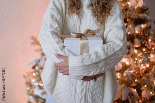 Anonymous woman holding chistmas gift photo