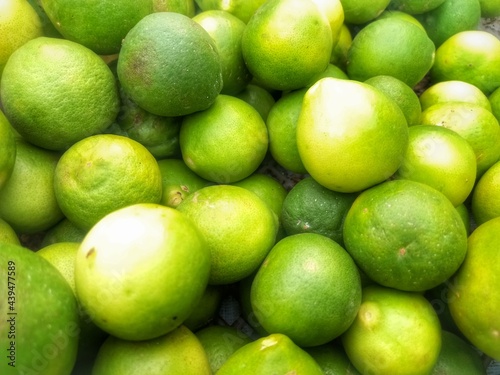 pile of limes in one of the sellers in the traditional market