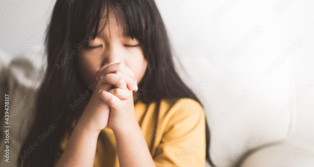 Asian kid girl read bible study.Worship at home.Sunday school.Bible on kid hands.Family christian ,Reading bible study.Hands holding on a Holy Bible.faith, spirituality and religion.child Pray online. Asian kid girl read bible study.Worship at home.Sunday school.Bible on kid hands.Family christian ,Reading bible study.Hands holding on a Holy Bible.faith, spirituality and religion.child Pray online.