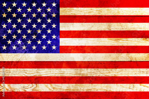 American flag on old scratched boards with grunge effect. photo