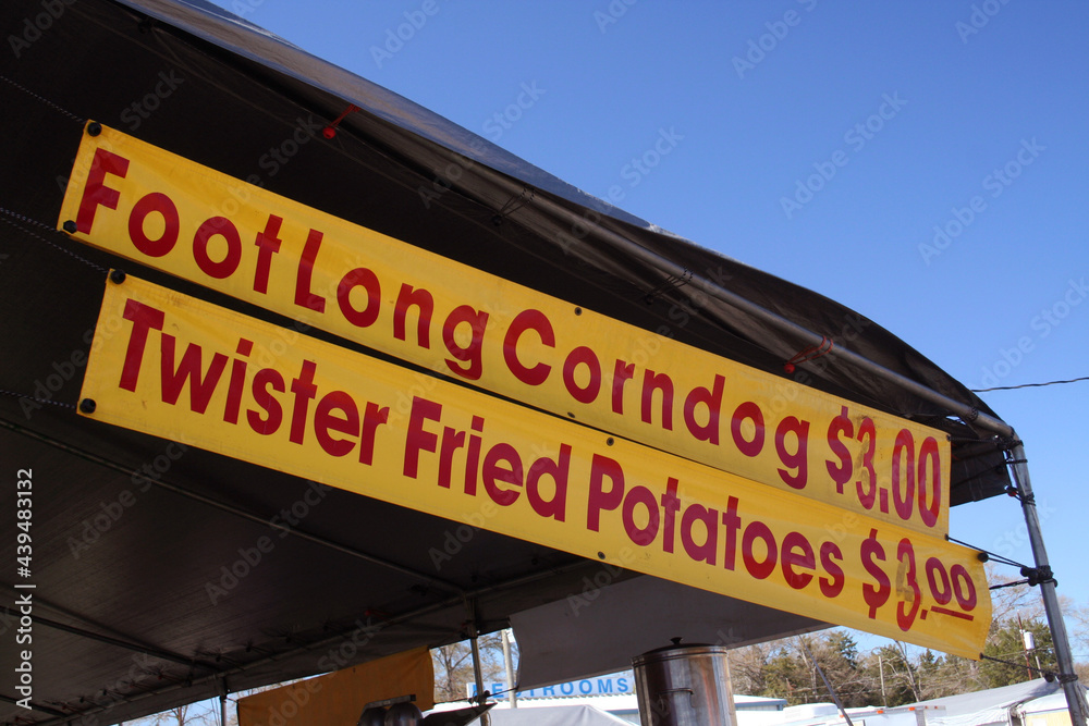 Food Vendor at County Fair With Signs