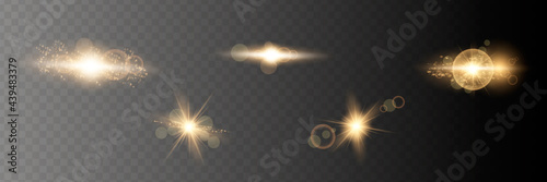 Set. Shining star, the sun particles and sparks with a highlight effect, golden bokeh lights glitter and sequins. On a dark background transparent. Vector,