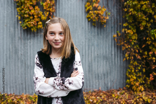 Portrait of vibrant young girl outside in city. photo