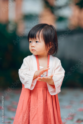 portrait of cute Chinese little girl handclap
 photo