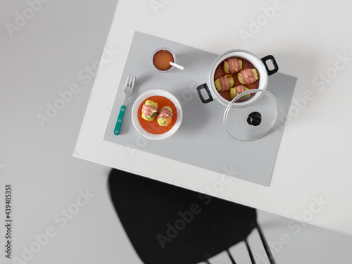 Miniature served table with comforting food in a minimalist space photo
