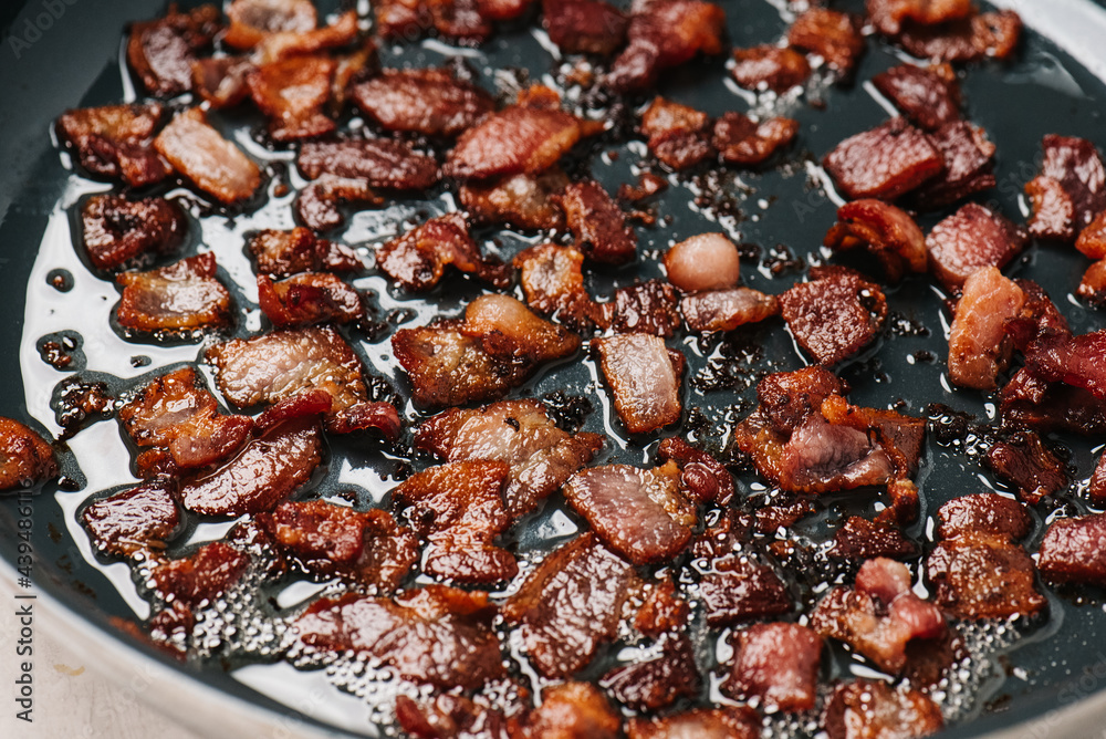Frying bacon pieces Frying bacon pieces