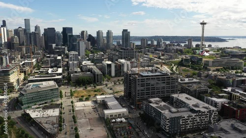 Cinematic 4K aerial orbiting drone footage of downtown Seattle, Uptown, Belltown, Danny Triangle, Seattle Center, Space Needle, Elliott Bay with high-rise office and residential buildings in Seattle photo