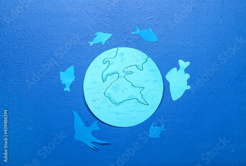 Paper planet Earth and fish...