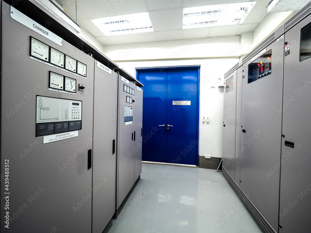 Electrical panel of inverter and battery charger systems for storage power from battery in power plant.