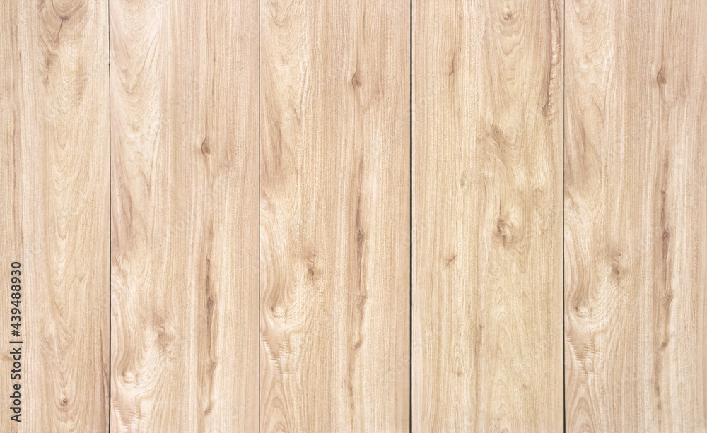 Fototapeta premium Wooden wall texture in vertical patterns for light brown background