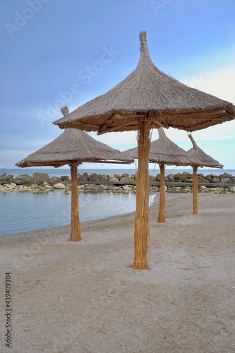 Beach with umbrellas on the shores of the Black Sea.  The ideal place to relax and spend wonderful moments.