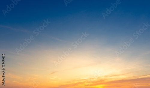 Beautiful Vivid sky painted by the sun leaving bright golden shades.Dense clouds in twilight sky in winter evening.Image of cloud sky on evening time.Evening Vivid sky with clouds.