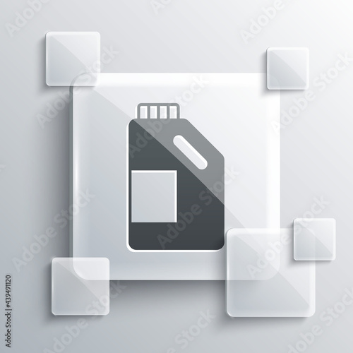 Grey Plastic bottle for laundry detergent, bleach, dishwashing liquid or another cleaning agent icon isolated on grey background. Square glass panels. Vector