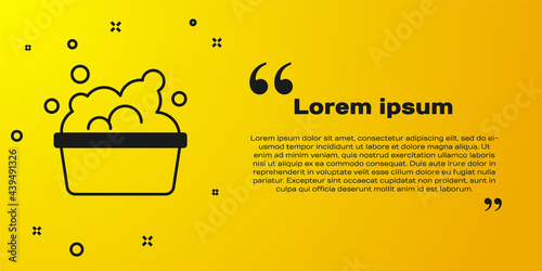 Black Plastic basin with soap suds icon isolated on yellow background. Bowl with water. Washing clothes, cleaning equipment. Vector